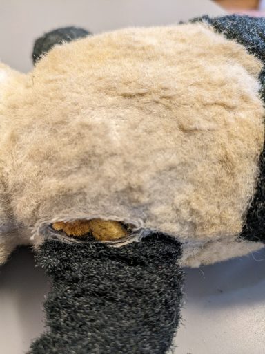 The fabric has split near the arm seam
