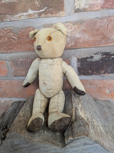 Old teddy with a new matching head